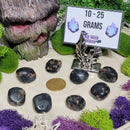 Pierre roulée obsidienne flocon de neige rouge